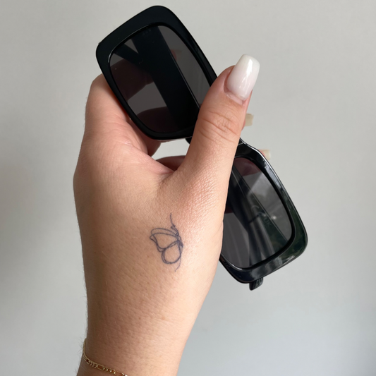 Tillfällig tatuering fjäril finlinje